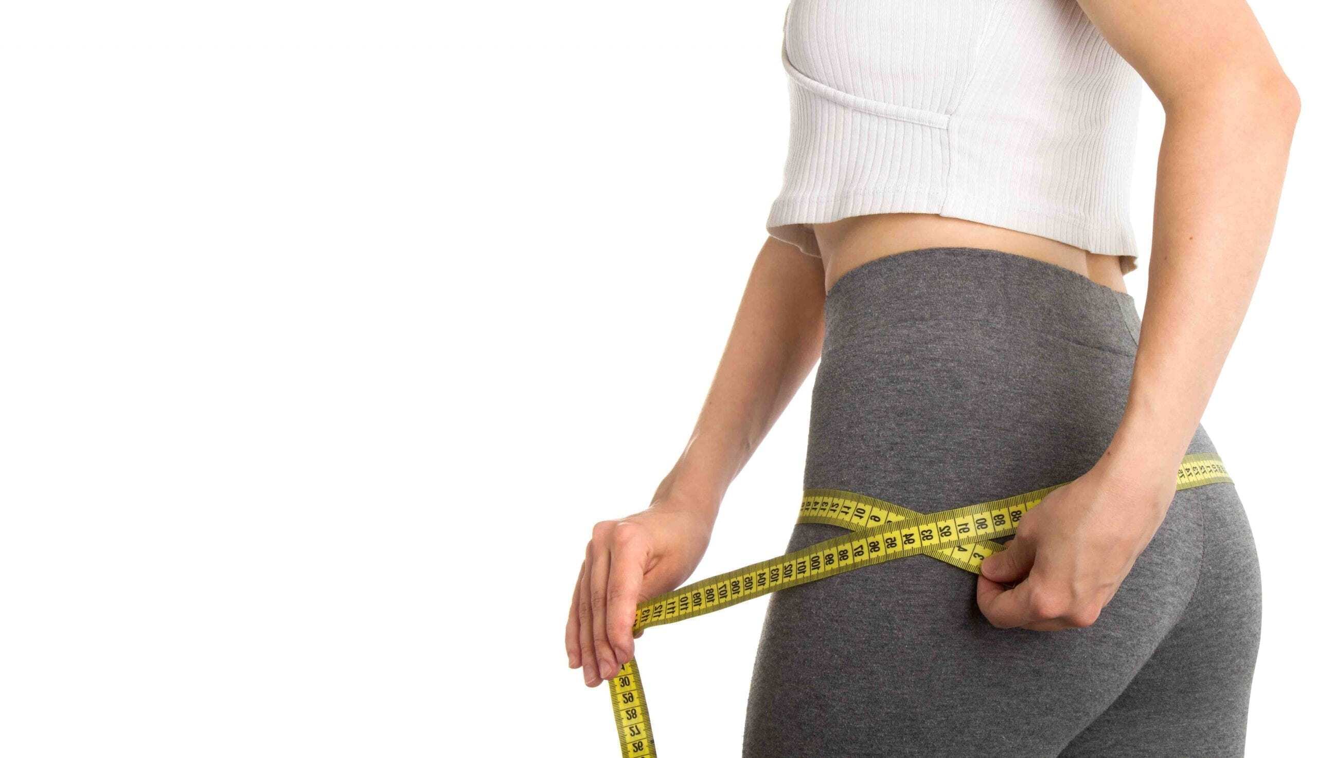 bigstock-Woman-Measuring-Her-Body-Slim-325489567-scaled